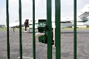 LMKQV2_SHKL__Airplane_behind_green_swing_gate_pilot_entering__1920px.webp