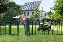 SUBY_LAKZP1_SMKL_GBM12_CGS__Woman_effortlessly_opening_green_garden_gate_lawnmower__1920px.webp