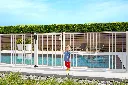 LAKZP1WSI_SMKL_MAMMOTH_RHINO__Little_girl_by_white_pool_gate__1920px.webp